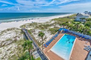 an overhead view of a swimming pool and the beach at SeaSpray West 603- Gulf Front in Perdido Key