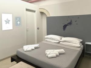 Postel nebo postele na pokoji v ubytování KiMia Home, Centro