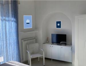 TV a/nebo společenská místnost v ubytování KiMia Home, Centro