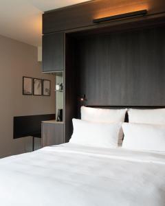 Postel nebo postele na pokoji v ubytování SOLLER Business Hotel - Munich Airport MUC
