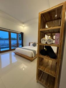 Postel nebo postele na pokoji v ubytování Bayedan Homestay