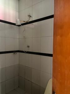 a bathroom with a shower with a toilet at Araujo in Governador Valadares