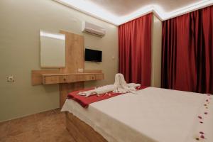 Postel nebo postele na pokoji v ubytování Tunacan Hotel