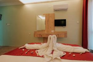 Postel nebo postele na pokoji v ubytování Tunacan Hotel