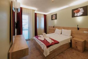 Postel nebo postele na pokoji v ubytování Tunacan Hotel