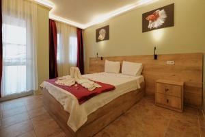 Postel nebo postele na pokoji v ubytování Tunacan Hotel