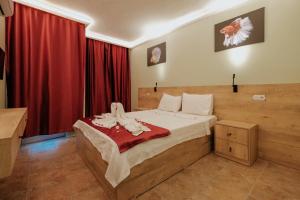 Postel nebo postele na pokoji v ubytování Tunacan Hotel