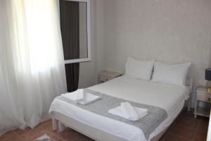 Postel nebo postele na pokoji v ubytování Tunacan Hotel