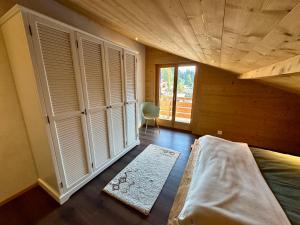 Postel nebo postele na pokoji v ubytování Chalet EVEREST