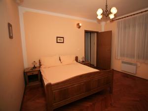 Posteľ alebo postele v izbe v ubytovaní Apartments Vrata Baranje
