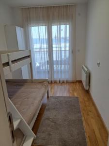 Postel nebo postele na pokoji v ubytování Apartman 1
