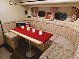 a table in the back of a caravan with candles on it at Prinsessan i Lilla Bommen in Gothenburg +21 photos
