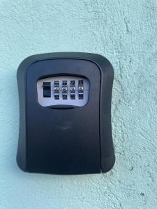 a black object is attached to a wall at Casa fechada in Pirenópolis