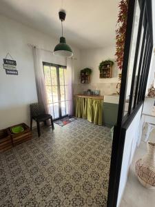 a living room with a table in a room at Casa Nostra in Olmeto