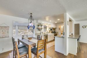a kitchen and dining room with a table and chairs at Family Home with Games and Fenced Yard in South Ogden in South Ogden