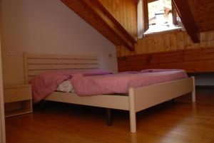 Postel nebo postele na pokoji v ubytování Maso Anna