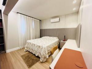 Postel nebo postele na pokoji v ubytování Residencial Turin - Cobertura para 8 pessoas na Praia de Palmas a 350m do mar