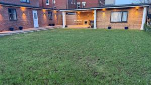 an empty yard in front of a brick building at Peace house in Waterlooville