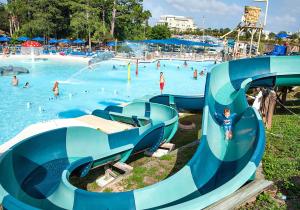 a water park with people in a pool at Vista del Mar I - Ocean Overlook 302 in Panama City Beach