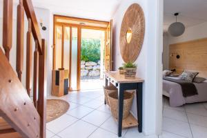 a bedroom with a bed and a table with a mirror at Magnifique villa avec piscine et climatisation in Lombez +19 photos