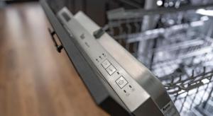 a remote control sticking out of a dishwasher at Parrot’s House in Lloret de Mar
