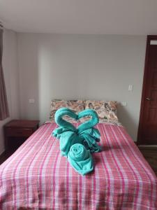 Postel nebo postele na pokoji v ubytování Hostal Terranova Quitumbe