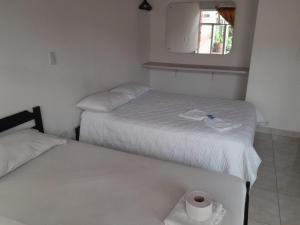 Cama o camas de una habitación en Hotel Tame Real