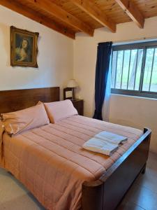 En eller flere senge i et værelse på Rancho La Paz