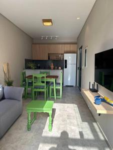 a living room with a couch and a table at Casa Villa Bali in Marechal Deodoro +11 photos