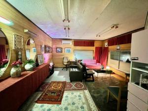 a living room with a couch and a table at Shimahama in Miyazaki
