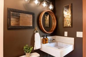 a bathroom with a white sink and two mirrors at Treehouse - Close to Slopes, Hot Tub, Gourmet Kitchen, Deck in Big Bear Lake +32 photos