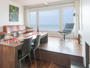 a living room with a table and a couch at Studio in Ostend near Beach and Promenade in Ostend