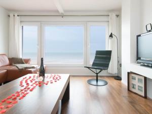 a living room with a couch and a table at Studio in Ostend near Beach and Promenade in Ostend