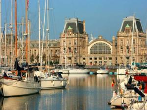 a group of boats in the water in front of a building at Studio in Ostend with Stunning Sea Views in Ostend