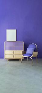 a purple room with a chair and a dresser at Perfect Place to be in Hannover