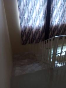 a view of a window with a metal curtain at Dunbar's Two bedroom in Montego Bay
