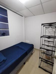 Ένα ή περισσότερα κρεβάτια σε δωμάτιο στο Casa cerca del Centro de Santa Ana