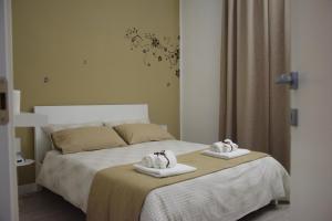 Кровать или кровати в номере Appartamento XII Gennaio 3