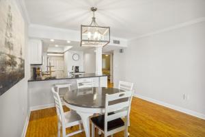 a kitchen and dining room with a table and chairs at Land's End 5-204 Gulf-Bay Front - Premier in St. Pete Beach