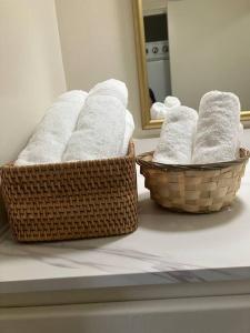 two baskets of towels on a counter in a bathroom at Taos Pine Home in Taos