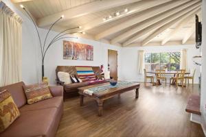 a living room with a couch and a table at Taos Pine Home in Taos