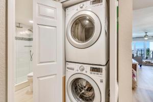 a laundry room with a washer and dryer at Land's End 6-302 Beach Front - Premier in St Pete Beach