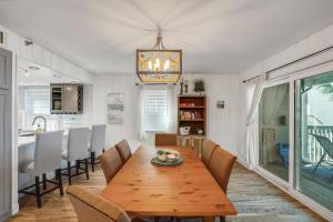 a dining room with a wooden table and chairs at Pelican Pointe 2C in Clearwater Beach