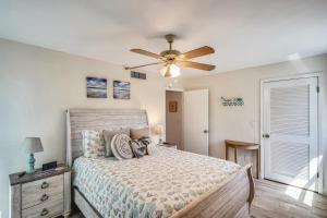 a bedroom with a bed and a ceiling fan at Pelican Pointe 2C in Clearwater Beach