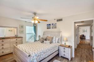 a bedroom with a bed and a ceiling fan at Pelican Pointe 2C in Clearwater Beach