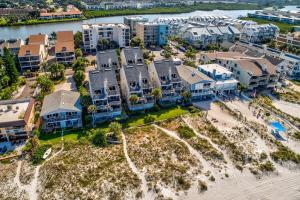 an aerial view of a resort with a beach and buildings at Pelican Pointe 2C in Clearwater Beach