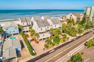 an aerial view of a street with houses and the ocean at Pelican Pointe 2C in Clearwater Beach