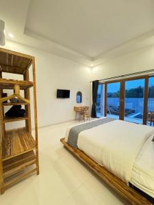 Postel nebo postele na pokoji v ubytování Bayedan Homestay