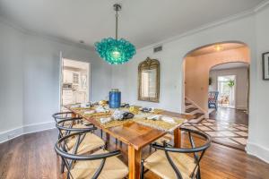 a dining room with a wooden table and chairs at John Ringling House in Sarasota