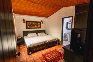 Postel nebo postele na pokoji v ubytování HOTEL COMPOSTELLA